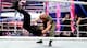 Erick Rowan sends Seth Rollins to the mat.