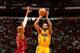Indiana Pacers guard Rasual Butler shoots over Miami Heat guard Ray Allen.