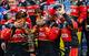 Brad Keselowski signals that he is OK with sharing the lobster he won at New Hampshire with his team.