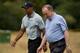 Tiger Woods walks with R&A chief Peter Dawson during a practice round.