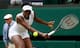 Venus Williams prepares to hit a backhand volley during a third-round match at Wimbledon.