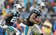 Kenjon Barner (left) trailing former Panther Ted Ginn Jr. on a kickoff return