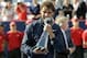 Rafael Nadal takes his traditional trophy bite after winning the 2013 Rogers Cup.