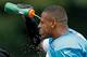 Defensive end Greg Hardy trying to cool down in the afternoon heat