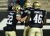 RB Christian Powell celebrates with teammates.