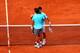 Rafael Nadal and Novak Djokovic embrace at the net, after Nadal won the 2014 French Open.