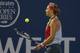 Victoria Azarenka bounces a ball on her racket at the 2014 Bank of the West Classic.