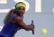 Serena Williams prepares to hit a backhand at the 2014 Bank of the West Classic.