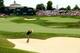 Adam Scott takes on a difficult bunker shot.
