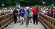 Tiger Woods shot a first-round 73, but drew a throng of followers every step of the way.