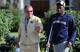 Brian Kelly and Torii Hunter Jr. walk into Saturday's practice.