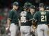 Melvin looks on during a meeting of the minds at the mound.