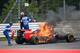 Daniil Kvyat watches his burning car at the German Grand Prix.