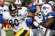 Steelers tight end Eric Waters avoids a Bills defender during practice on Thursday.