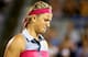 Victoria Azarenka struggles to hide her disappointment during a loss at the 2014 Rogers Cup in Montreal.