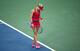Eugenie Bouchard looks down between points during her opening-round loss in Cincinnati.