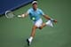 Novak Djokovic leaps toward a forehand during a match in Cincinnati.