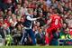 Chelsea's manager Jose Mourinho, left, keeps the ball from Liverpool's Steven Gerrard during their English Premier League soccer match at Anfield Stadium, Liverpool, England, Sunday April 27, 2014. (AP Photo/Jon Super)