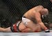 Shawn Jordan (top) pounds Jack May
