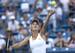 Caroline Wozniacki serves during a match against Serena Williams at the Western & Southern Open in Cincinnati.
