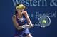 Agnieszka Radwanska hits a backhand during a match at the Western & Southern Open in Cincinnati.