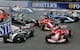 The cars battle into the first corner in 2004.