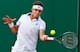 Jiri Vesely hits a forehand during a 2014 Wimbledon match.