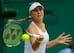 Belinda Bencic hits a forehand during a match at the 2014 Wimbledon Championships.