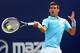 Novak Djokovic hits a forehand during a match at the 2014 Rogers Cup.