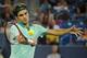Roger Federer hits a forehand during a match at 2014 Western & Southern Open.