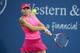 Simona Halep concentrates on the ball during a match at the 2014 Western & Southern Open.