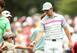 Rory McIlroy makes a young fan happy with a golf ball.