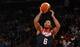 Aug 22, 2014; New York, NY, USA; United States guard Derrick Rose (6) shoots over Puerto Rico guard Jose Juan Barea (5) during the first quarter of a game at Madison Square Garden. Mandatory Credit: Brad Penner-USA TODAY Sports