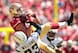 Steve Williams attempts to take down tight end Vance McDonald.