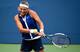 Victoria Azarenka hits a backhand during a match at the 2014 U.S. Open.