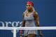Serena Williams wears her night-time leopard design during her first match at the 2014 U.S. Open.
