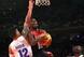 Aug 22, 2014; New York, NY, USA; United States guard Kyrie Irving (10) drives to the basket past Puerto Rico guard David Huertas (12) and center Ramon Clemente (4) during the second quarter of a game at Madison Square Garden. Mandatory Credit: Brad Penner