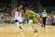 Slovenia's Goran Dragic drives on Team USA's Derrick Rose.