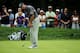 Jim Furyk watches a putt head to the hole.