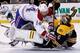 Tomas Plekanec runs over Tuukka Rask.