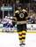 Zdeno Chara skates away as the Montreal Canadiens celebrate in the background.