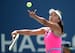 Shuai Peng serves during her quarterfinal match at the 2014 U.S. Open.