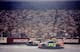 Action from 1998: Jeff Gordon (24) battles eventual race winner Jeff Burton (99).