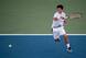 Kei Nishikori rips a forehand during his match against Stan Wawrinka.