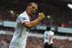 Rio Ferdinand celebrates as Manchester United score at Anfield.