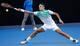 Roger Federer leans to make a play during his first-round match at the Australian Open.