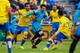 Barcelona's Lionel Messi fights for the ball against Las Palmas' Pedro Bigas, left, during a Spanish La Liga soccer match between Las Palmas and Barcelona, at the Gran Canaria stadium in Las Palmas de Gran Canaria island, Spain, Saturday, Feb. 20, 2016. (