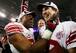 Michael Strahan and Eli Manning's New York Giants blocked the New England Patriots from perfection.