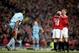 Nicky Butt celebrates with Paul Scholes after a goal against Manchester City.