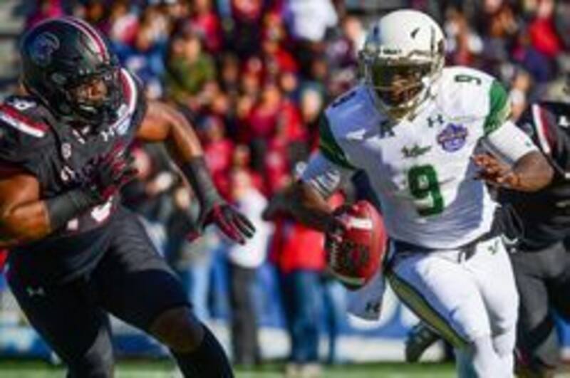 Dual-threat quarterback Quinton Flowers has the ability to continue the Bulls' successful offensive run, even without former coach Willie Taggart.